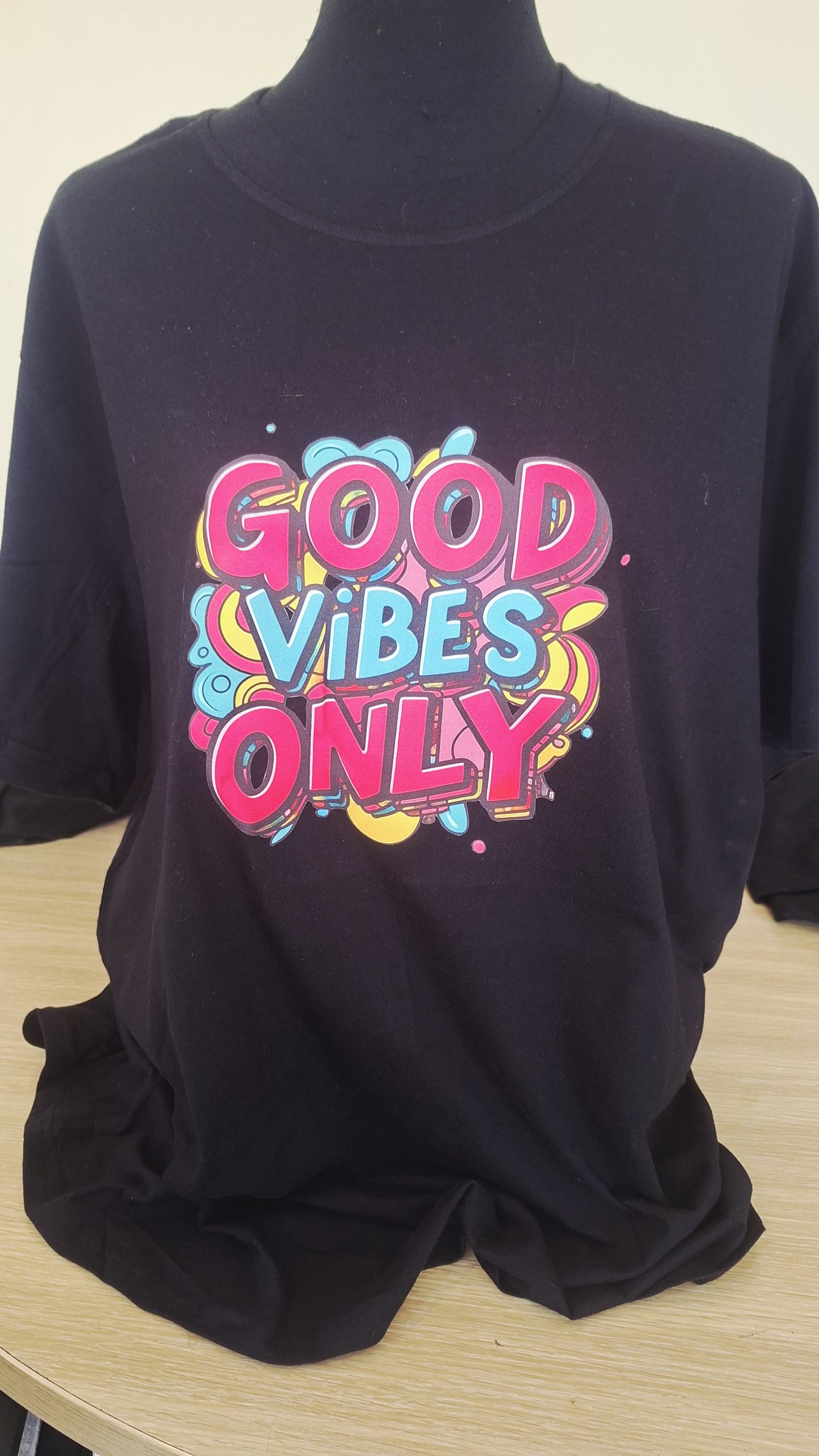 Black personalised T-shirt with colourful Good Vibes Only graphic print